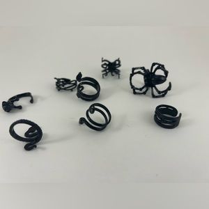 Set of 8 black toned adjustable rings